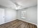 Bedroom with wood-look floors and ceiling fan at 2712 Mock Orange Ct, Valrico, FL 33594