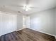 Bedroom with double closet and wood-look floors at 2712 Mock Orange Ct, Valrico, FL 33594