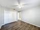 Bedroom with double closet and wood-look floors at 2712 Mock Orange Ct, Valrico, FL 33594