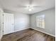 Bedroom with wood-look floors and ceiling fan at 2712 Mock Orange Ct, Valrico, FL 33594