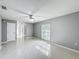 Spacious bedroom with tile floors and window with blinds at 2712 Mock Orange Ct, Valrico, FL 33594