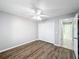 Spacious bedroom with double door closet and wood-look floors at 2712 Mock Orange Ct, Valrico, FL 33594