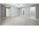 Bright bedroom featuring ample closet space and tile flooring at 2712 Mock Orange Ct, Valrico, FL 33594