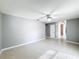 Bright bedroom with tile floors and access to hallway at 2712 Mock Orange Ct, Valrico, FL 33594