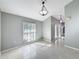 Bright dining room with tile floors and neutral walls at 2712 Mock Orange Ct, Valrico, FL 33594
