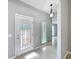 Light and airy entryway showcasing a glass front door at 2712 Mock Orange Ct, Valrico, FL 33594
