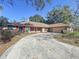 House exterior, red shutters, landscaping at 2712 Mock Orange Ct, Valrico, FL 33594