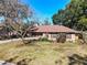 House exterior with red shutters and landscaping at 2712 Mock Orange Ct, Valrico, FL 33594