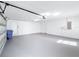 Clean and spacious garage with overhead door and interior access at 2712 Mock Orange Ct, Valrico, FL 33594