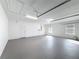 Bright and clean garage featuring an overhead door and extra storage at 2712 Mock Orange Ct, Valrico, FL 33594