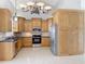 Bright kitchen with stainless steel appliances and granite countertops at 2712 Mock Orange Ct, Valrico, FL 33594