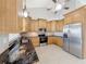 Modern kitchen with stainless steel appliances and granite countertops at 2712 Mock Orange Ct, Valrico, FL 33594