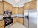 Updated kitchen with stainless steel appliances and granite countertops at 2712 Mock Orange Ct, Valrico, FL 33594