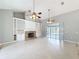 Spacious living room with fireplace, built-in shelving, and tile floors at 2712 Mock Orange Ct, Valrico, FL 33594