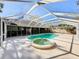 Inviting screened pool and spa with spacious surrounding deck at 2712 Mock Orange Ct, Valrico, FL 33594