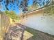 Side yard with wooden fence and landscaping at 2712 Mock Orange Ct, Valrico, FL 33594