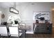 Elegant dining room with a modern light fixture and sideboard at 2808 Falling Leaves Dr, Valrico, FL 33596