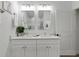 Modern bathroom with double vanity and updated fixtures at 3038 Sargeant St, Port Charlotte, FL 33948