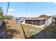 Backyard with shed and screened enclosure at 3421 Cantrell St, Holiday, FL 34690