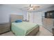 Serene bedroom with light green bedding and built in dresser at 3421 Cantrell St, Holiday, FL 34690