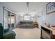Bright Gathering room with sliding doors leading to a screened porch at 3421 Cantrell St, Holiday, FL 34690