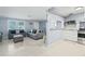 Open concept kitchen and living area with breakfast bar at 3421 Cantrell St, Holiday, FL 34690