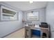Home office with wood desk and two windows at 3421 Cantrell St, Holiday, FL 34690