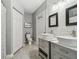 Clean bathroom, double vanity, and separate toilet area at 3607 Trafalgar Way # 103, Palm Harbor, FL 34685