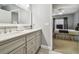 Double vanity bathroom with view of bedroom at 3607 Trafalgar Way # 103, Palm Harbor, FL 34685