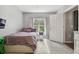Cozy bedroom with a double bed and window at 3607 Trafalgar Way # 103, Palm Harbor, FL 34685