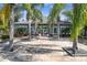 Waterford community clubhouse with palm trees and stone pathway at 3607 Trafalgar Way # 103, Palm Harbor, FL 34685