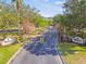 Gated entrance to WaterFord Condominium Residences, showing landscaping and signage at 3607 Trafalgar Way # 103, Palm Harbor, FL 34685