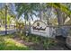 Waterford Condominium Residences sign at entrance, stonework and landscaping at 3607 Trafalgar Way # 103, Palm Harbor, FL 34685