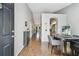 Open concept dining area with hardwood floors and a view to the living area at 3607 Trafalgar Way # 103, Palm Harbor, FL 34685