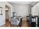 Dining area with hardwood floors and piano at 3607 Trafalgar Way # 103, Palm Harbor, FL 34685