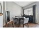 Small dining area with dark wood floors and piano at 3607 Trafalgar Way # 103, Palm Harbor, FL 34685