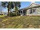 Townhouse exterior with a private screened patio at 3607 Trafalgar Way # 103, Palm Harbor, FL 34685