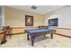Community game room with billiard table and bar stools at 3607 Trafalgar Way # 103, Palm Harbor, FL 34685