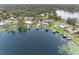Aerial view showing home's location on the lakefront at 3756 E Lake Dr, Land O Lakes, FL 34639
