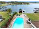 Aerial view of the property showing pool and lake access at 3756 E Lake Dr, Land O Lakes, FL 34639