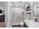Clean bathroom with walk in shower and pebble floor at 3756 E Lake Dr, Land O Lakes, FL 34639