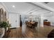 Bright dining room features hardwood floors and a large wooden table with seating for six at 3756 E Lake Dr, Land O Lakes, FL 34639