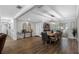 Bright dining room with a large wooden table and wicker chairs at 3756 E Lake Dr, Land O Lakes, FL 34639