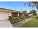 Ranch style home with attached garage and lush landscaping at 3756 E Lake Dr, Land O Lakes, FL 34639