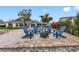 Patio with firepit, comfortable chairs, and a heater at 3756 E Lake Dr, Land O Lakes, FL 34639