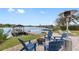 Lakefront patio with firepit and seating area at 3756 E Lake Dr, Land O Lakes, FL 34639