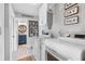 Laundry room with washer, dryer, and built-in storage at 3756 E Lake Dr, Land O Lakes, FL 34639