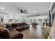 Spacious living area featuring a large sectional sofa and open floor plan at 3756 E Lake Dr, Land O Lakes, FL 34639