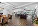 Open concept living room, dining, and kitchen area at 3756 E Lake Dr, Land O Lakes, FL 34639