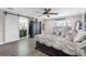 Spacious bedroom with a king-size bed, ensuite bathroom, and walk-in closet at 3756 E Lake Dr, Land O Lakes, FL 34639